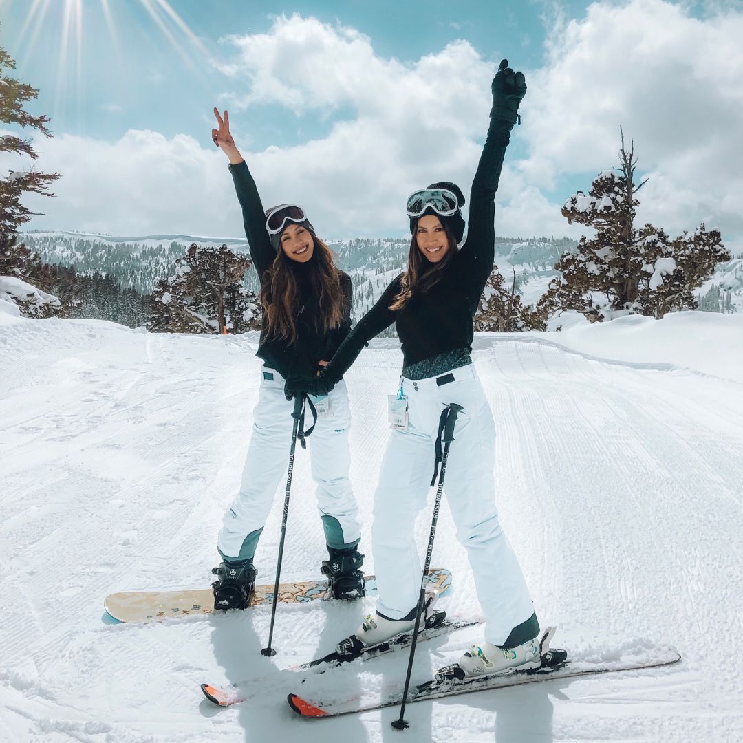 women snowboarding