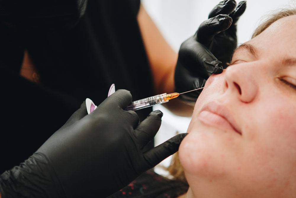 Aesthetician performing Dermal Fillers injections